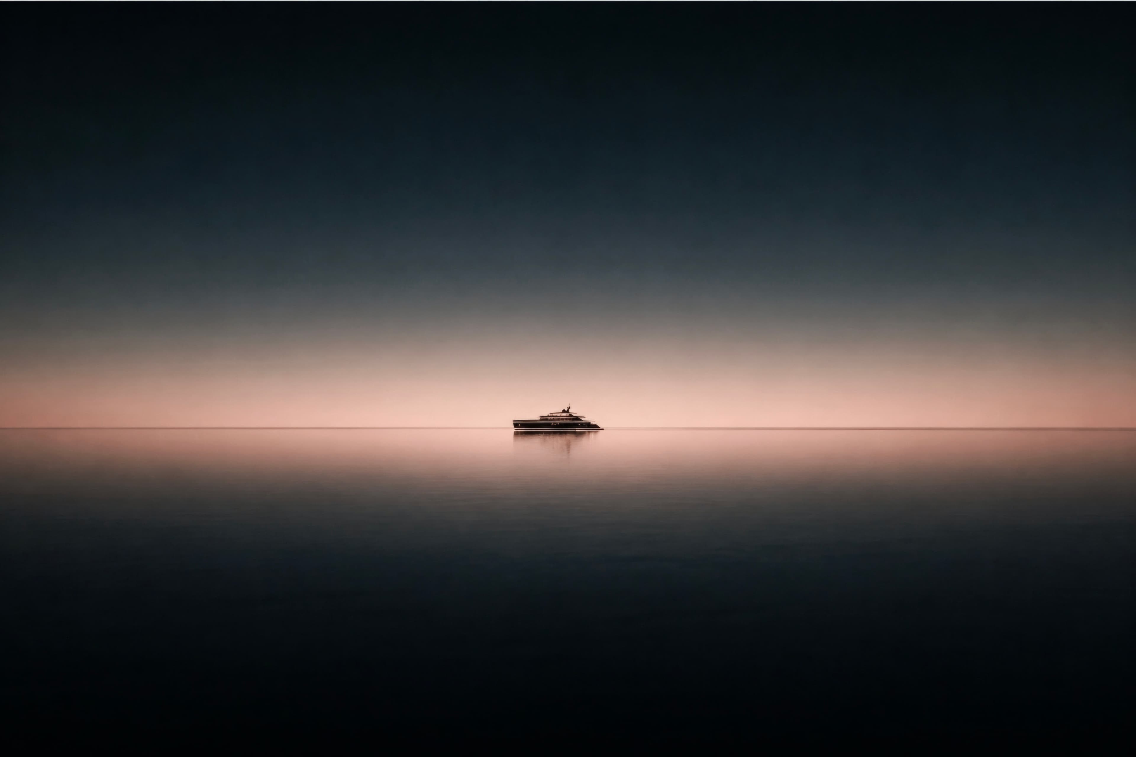 A yacht floating on a calm horizon at dusk as a quiet silhouette against the light.